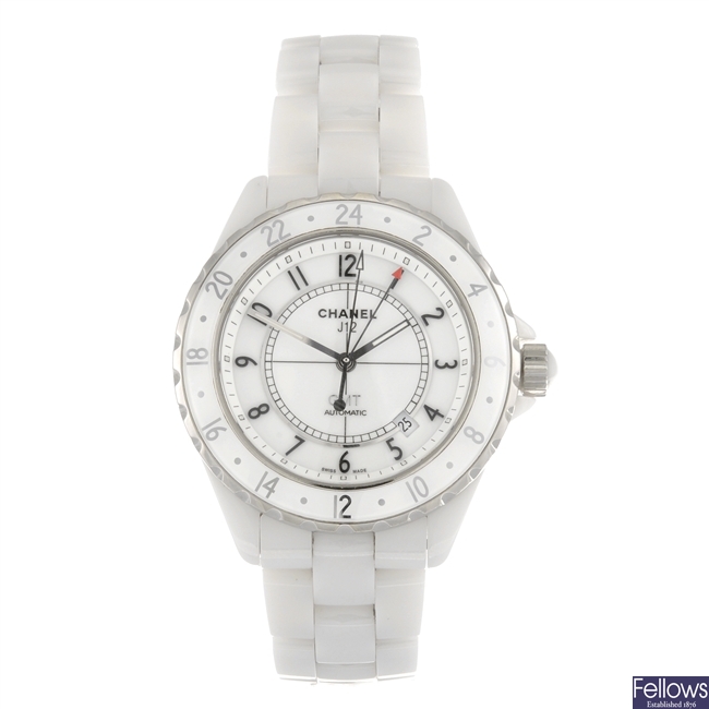 A white ceramic automatic Chanel J12 GMT bracelet watch.