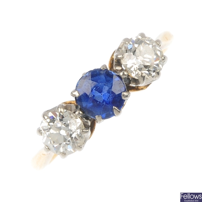 An 18ct gold and platinum sapphire and diamond three-stone ring.