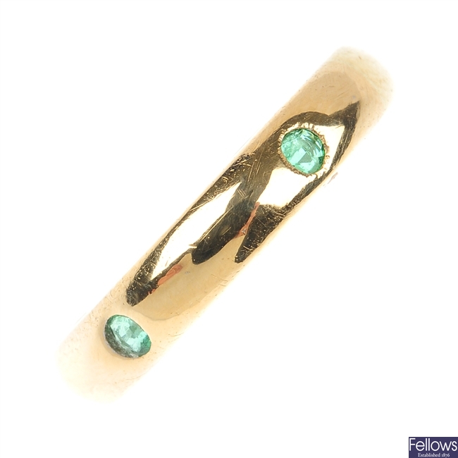CARTIER - an 18ct gold emerald band ring.