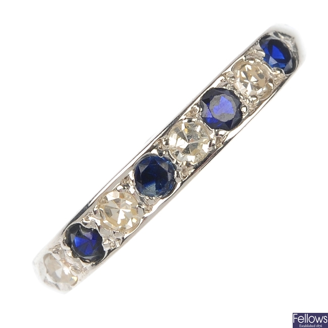An 18ct gold sapphire and diamond half-circle eternity ring.