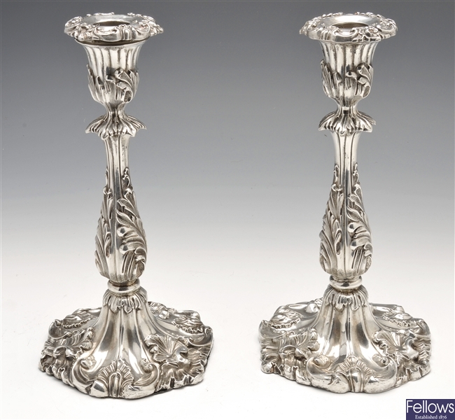 A Victorian pair of silver candlesticks.