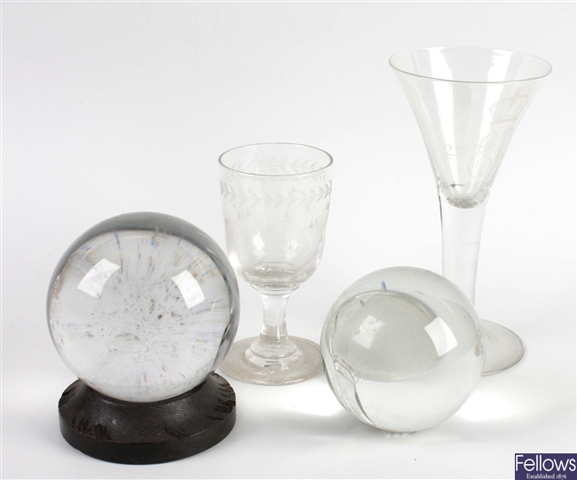Two crystal balls and a Whitefriars drinking glass