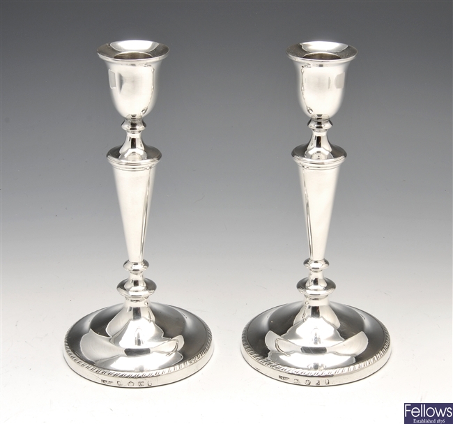 A pair of George III silver candlesticks.
