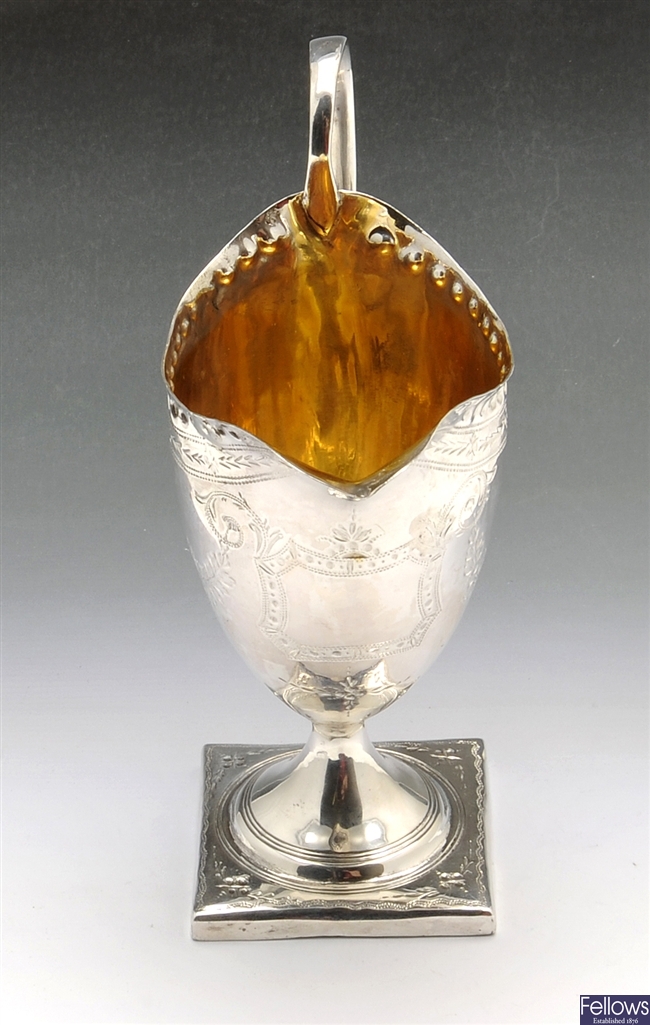 A George III silver pedestal  cream jug.