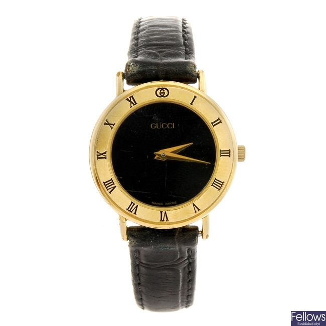LOT:51 | A gold plated quartz lady's Gucci 3000.2 L wrist watch.