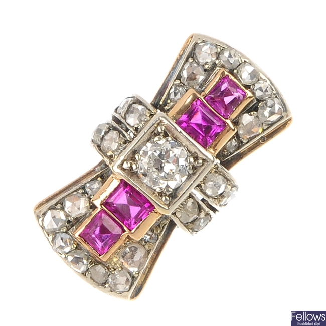 A diamond and synthetic ruby stylised bow ring.