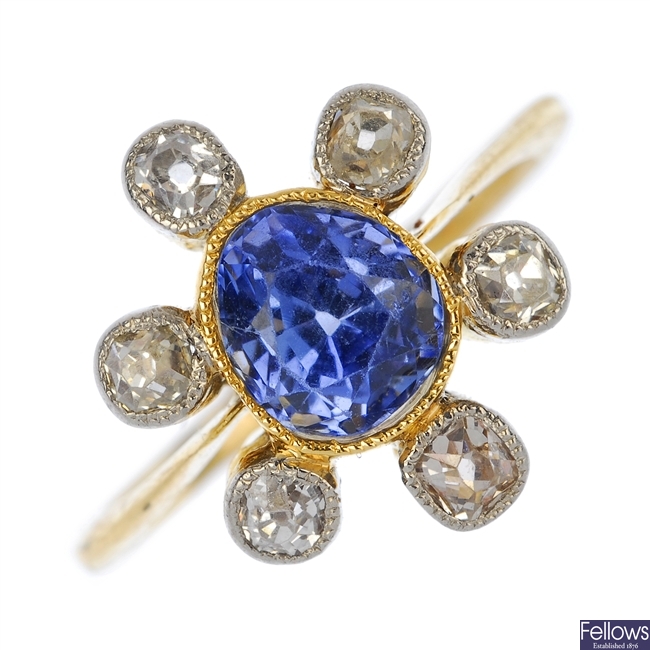 A mid 20th century gold sapphire and diamond cluster ring.