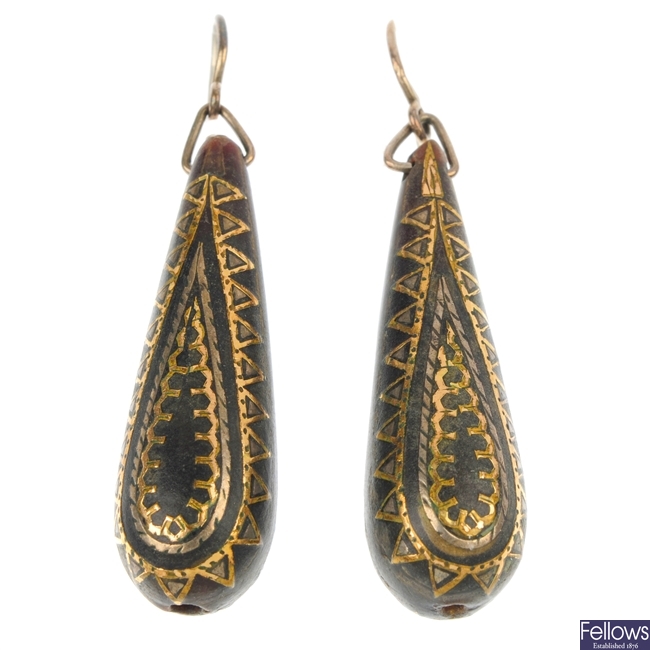 A pair of late 19th century pique tortoiseshell ear pendants.