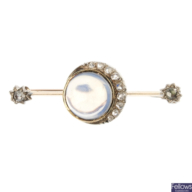 An early 20th century 15ct gold moonstone and diamond bar brooch.