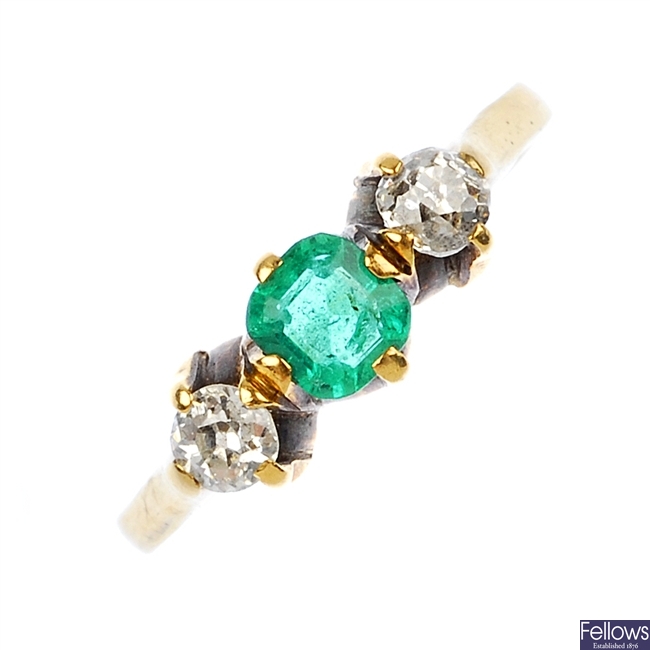 A late 19th century 18ct gold emerald and diamond three-stone ring.
