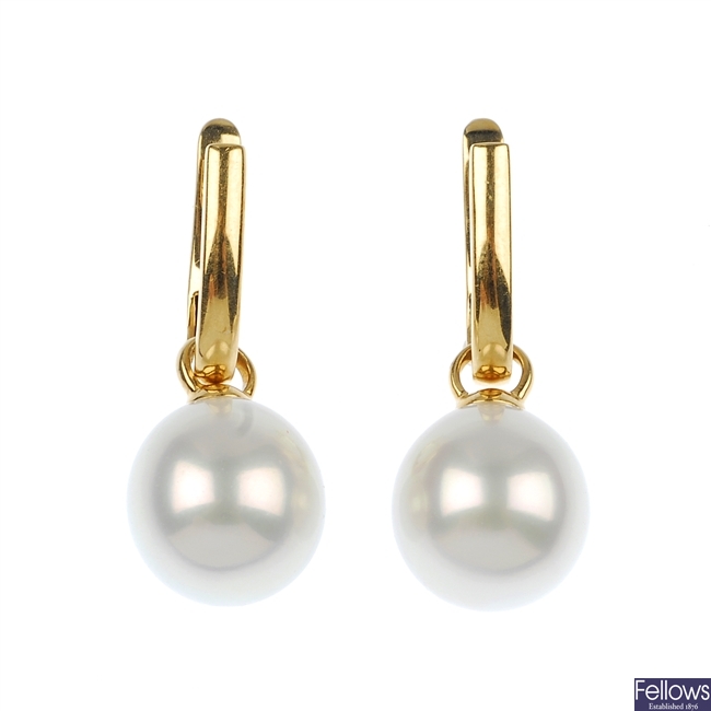 A pair of cultured pearl ear pendants.