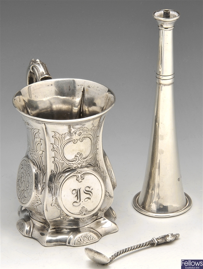 A silver christening mug, table lighter, etc.