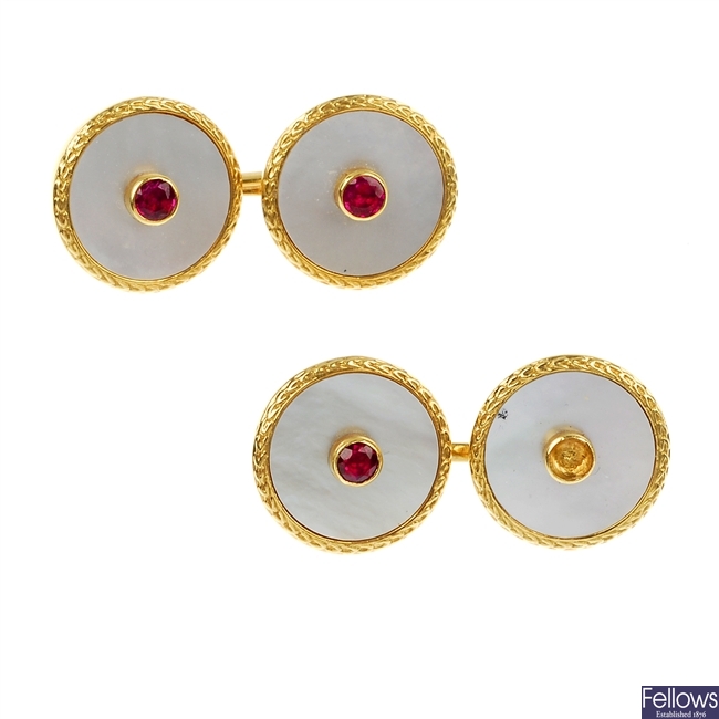 A pair of 18ct gold mother-of-pearl and ruby cufflinks.