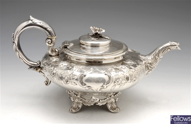 A Victorian silver teapot of squat form.