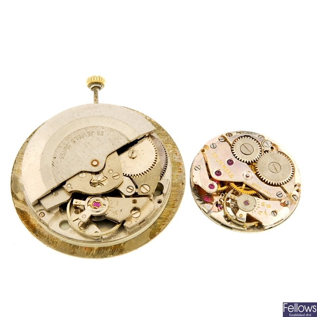 A group of assorted watch movements.