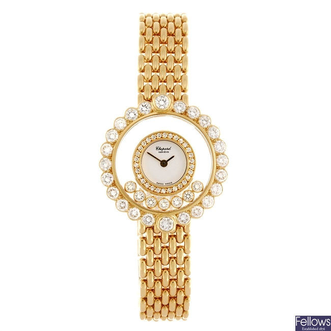 An 18k gold Chopard Happy Diamond bracelet watch.