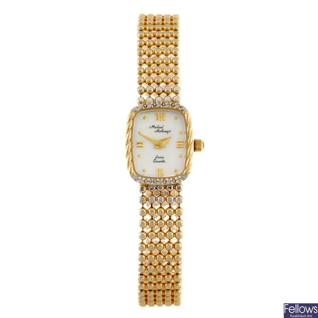 (1109015572) A 14k gold quartz lady's Michael Anthony bracelet watch.