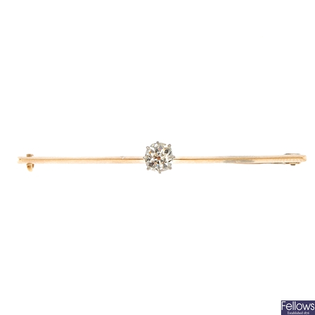 An early 20th century 12ct gold diamond bar brooch. 