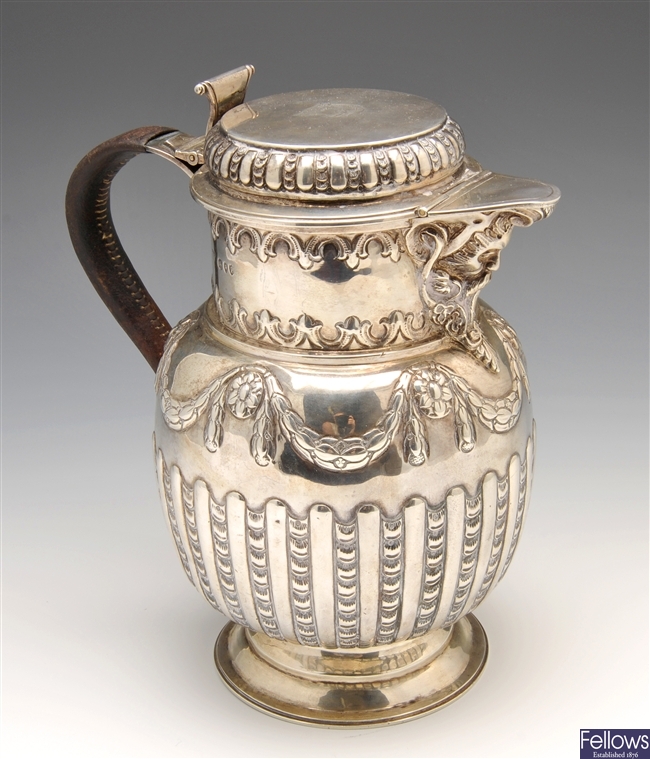 A Victorian silver lidded wine jug.