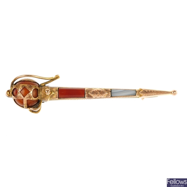 An early 20th century Scottish 9ct gold hardstone pin.