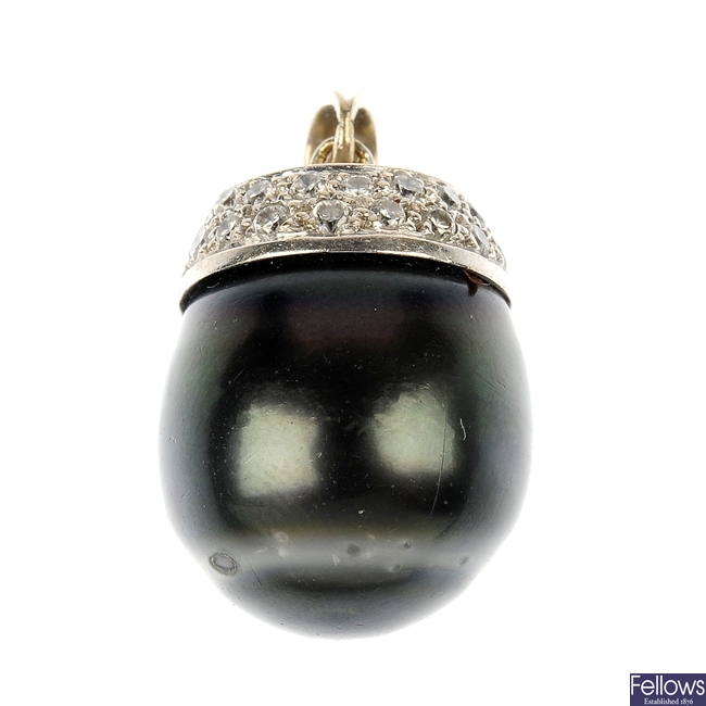 A stained cultured pearl and diamond pendant.
