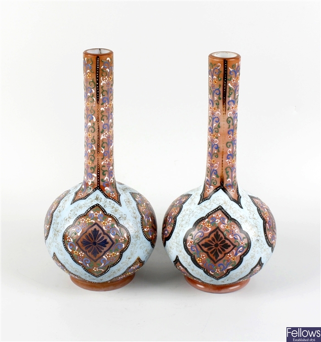 A pair of late 19th century opaque glass bottle vases