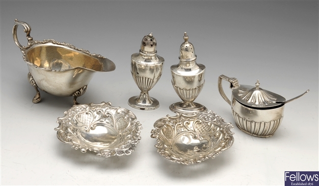 An Edwardian small silver sauce boat, condiments & trinket dishes.