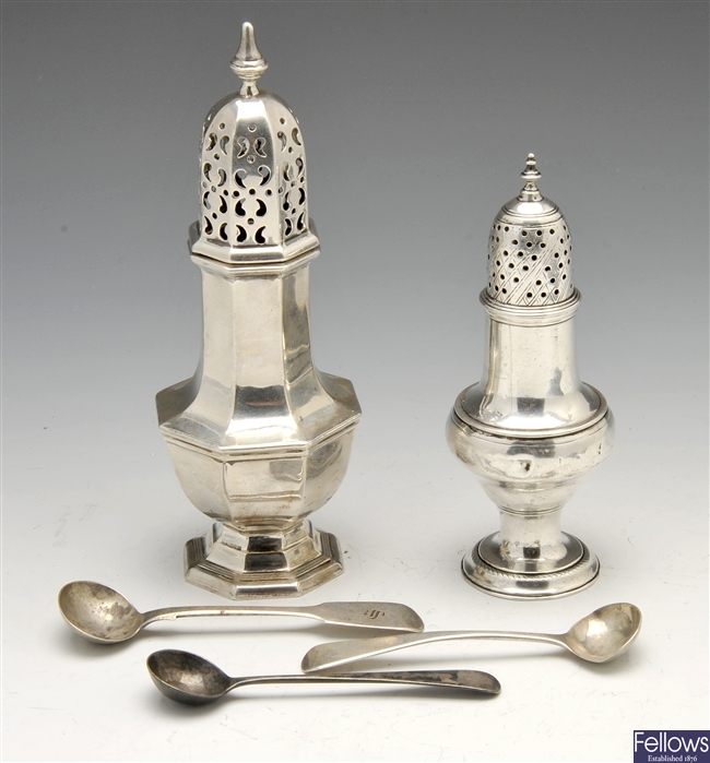 A late George III silver baluster form caster, a modern caster and three salt spoons.