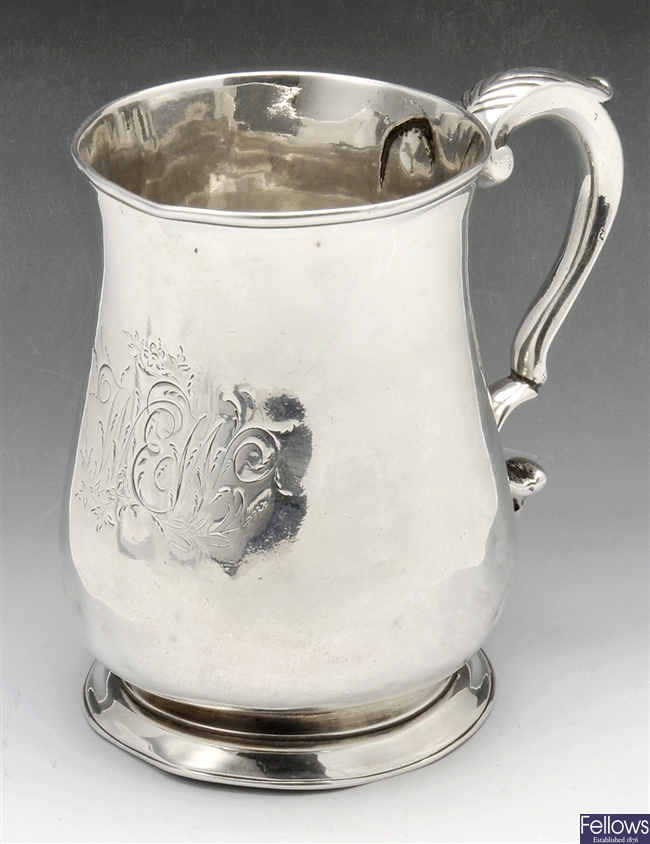 A George III silver half-pint mug.