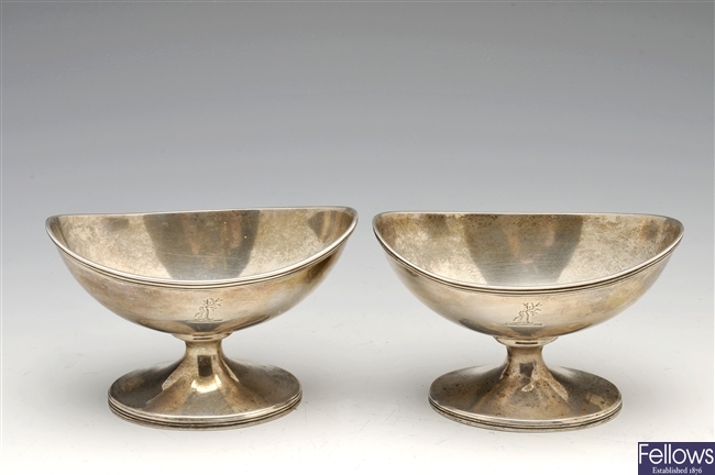 A George III matched pair of  silver pedestal open salts.