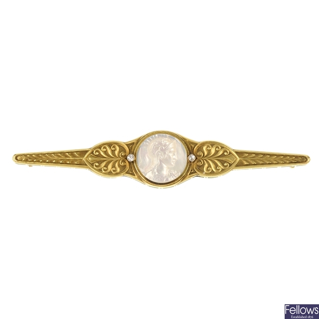 A mid 20th century mother-of-pearl cameo and diamond brooch.