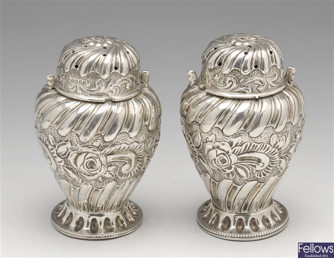 A Victorian pair of silver casters.