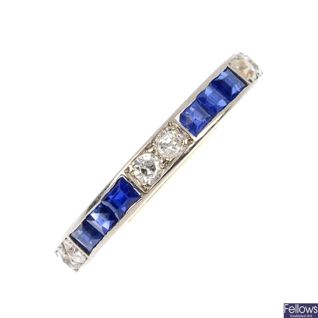 A mid 20th century 18ct gold and platinum sapphire and diamond full-circle eternity ring.