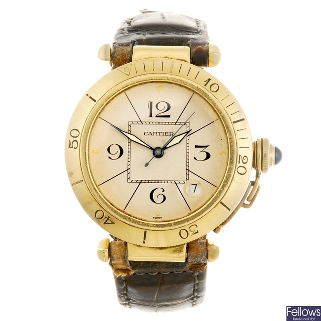 An 18k gold automatic Cartier Pasha wrist watch.