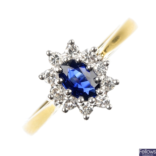 An 18ct gold sapphire and diamond cluster ring. 