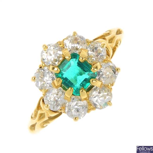 A late 19th century 18ct gold emerald and diamond cluster ring.
