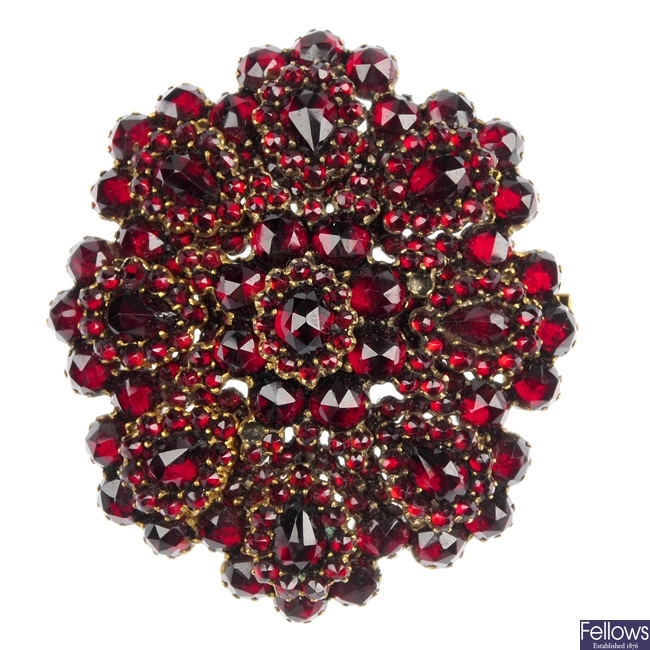 A late 19th century red glass photo pendant/brooch.