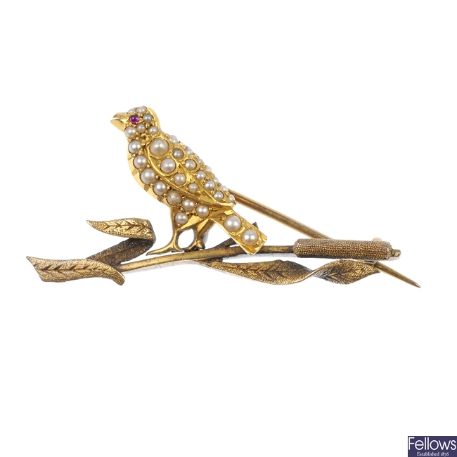 An early 20th century gold split pearl bird brooch.