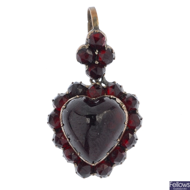 An early 20th century garnet and paste sentimental heart pendant.