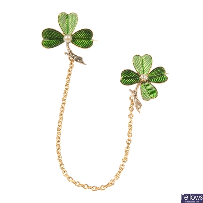 Two early 20th century 18ct gold diamond, seed pearl and enamel clover brooches.