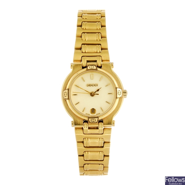 A gold plated quartz lady's Gucci 9200L bracelet watch.