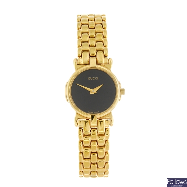 A gold plated quartz lady's Gucci 3400L bracelet watch.