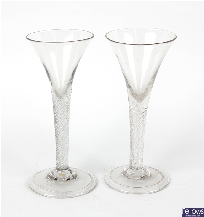 A near pair of mid 18th century cordial glasses