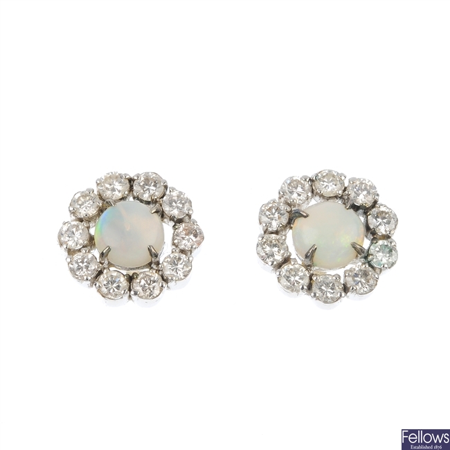 A pair of opal and diamond ear studs.