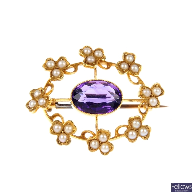 An early 20th century gold amethyst and split pearl oval brooch.