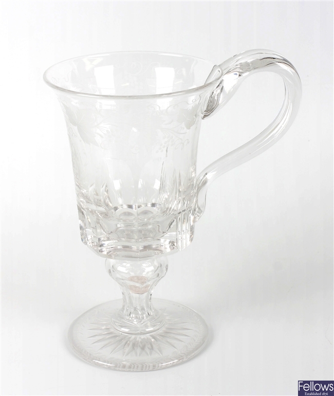 A Victorian engraved glass mug