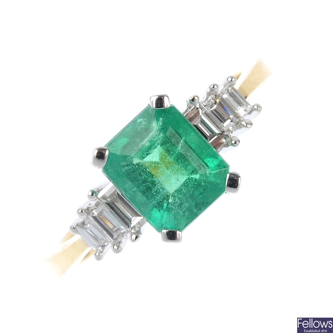 An emerald and diamond dress ring.