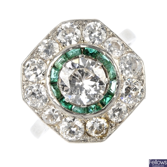 A mid 20th century diamond and emerald cluster ring.