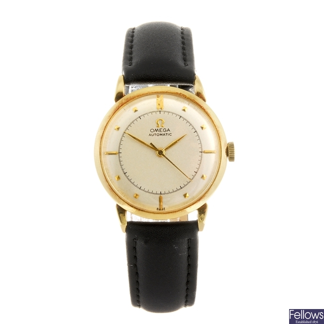 An 18k gold bumper automatic gentleman's Omega wrist watch.