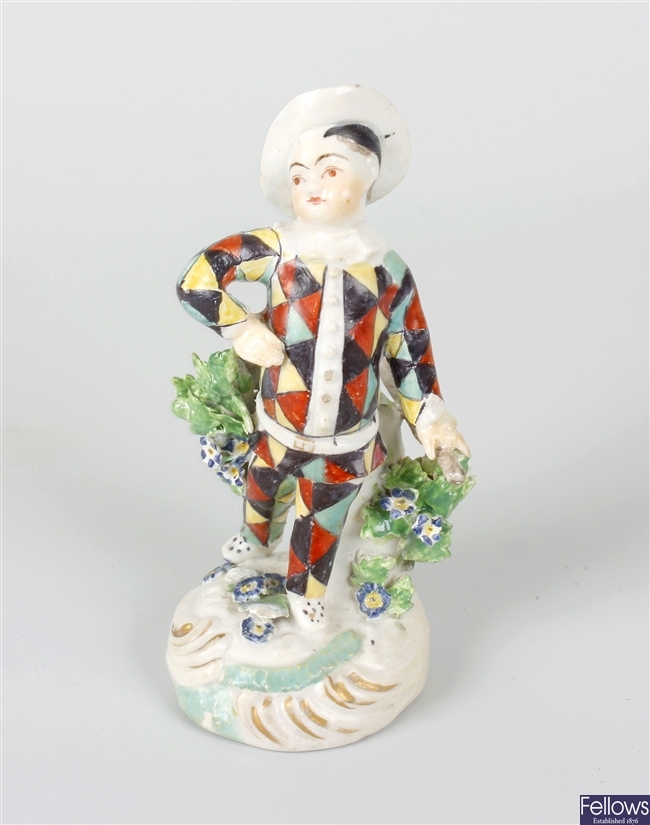An 18th century Derby-style porcelain figure of Harlequin or Pierrot